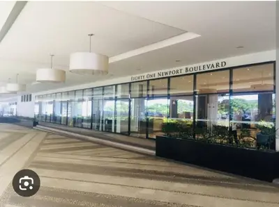a large building with a sign that reads north our northwesturned at Cozy Studio Flat Near Airport in Manila