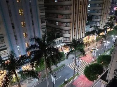 an aerial view of a city street with palm trees at Pasay Staycation with Parking Space in 150 Newport Boulevard near Resort World & NAIA T3 in Manila