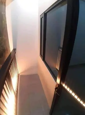 a staircase with a window and lights on it at Bloom Residences Condo 2Br in Manila