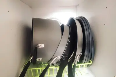 a row of suitcases hanging on a wall at Aveline Suites Cozy Skyline View ACQUA Private Residences near Rockwell Makati in Manila