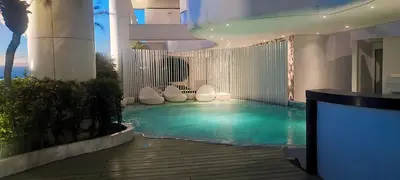 a swimming pool in the middle of a building at Aveline Suites Executive City View ACQUA Private Residences near Rockwell Makati in Manila