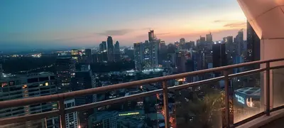 a view of a city skyline from a building at Aveline Suites Executive City View ACQUA Private Residences near Rockwell Makati in Manila