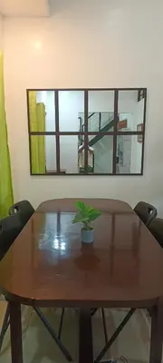 a wooden table with a potted plant on top of it at Misty Hills Guesthouse Amadeo - Tagaytay in Amadeo