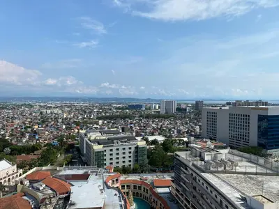 an aerial view of a city with buildings at nJoy! BOHO Luxury at Venice Grand Canal in Manila