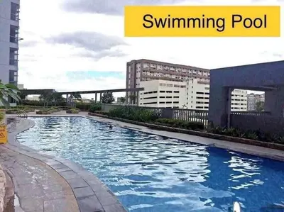 a swimming pool in the middle of a city at Cubao Manhattan, U 8J T D,Studio in Manila
