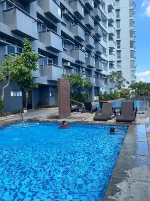 a large swimming pool in front of a building at Cubao Manhattan, U 8J T D,Studio in Manila