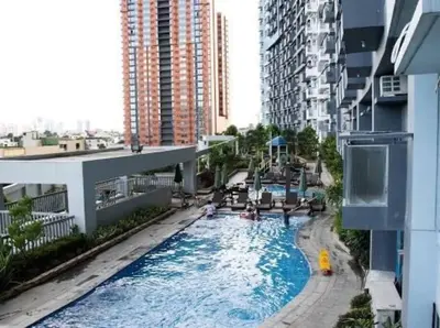 a view of a swimming pool in a building at Cubao Manhattan, U 8J T D,Studio in Manila