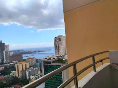 a view of the city from the balcony of a building at BirchTower Studio Condo with Balcony & Pool - Carosa Staycation in Manila