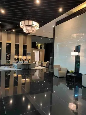 a lobby with couches and chairs in a building at Scandinavian Studio in Makati in Manila