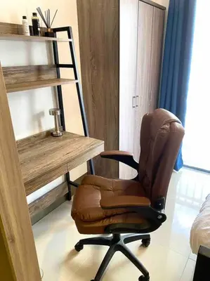 a office with a desk and a chair in a room at Modern 1-BR Condo Unit in Manila